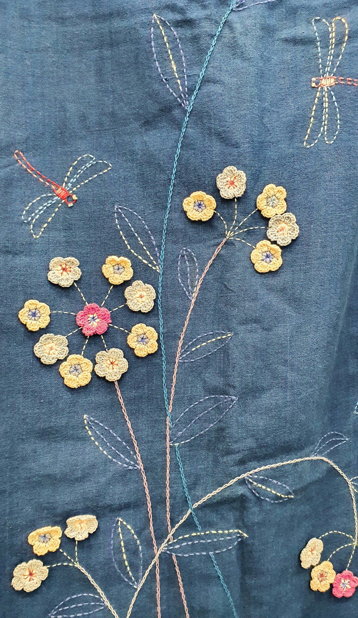 detailed stitched floral motif on linen
