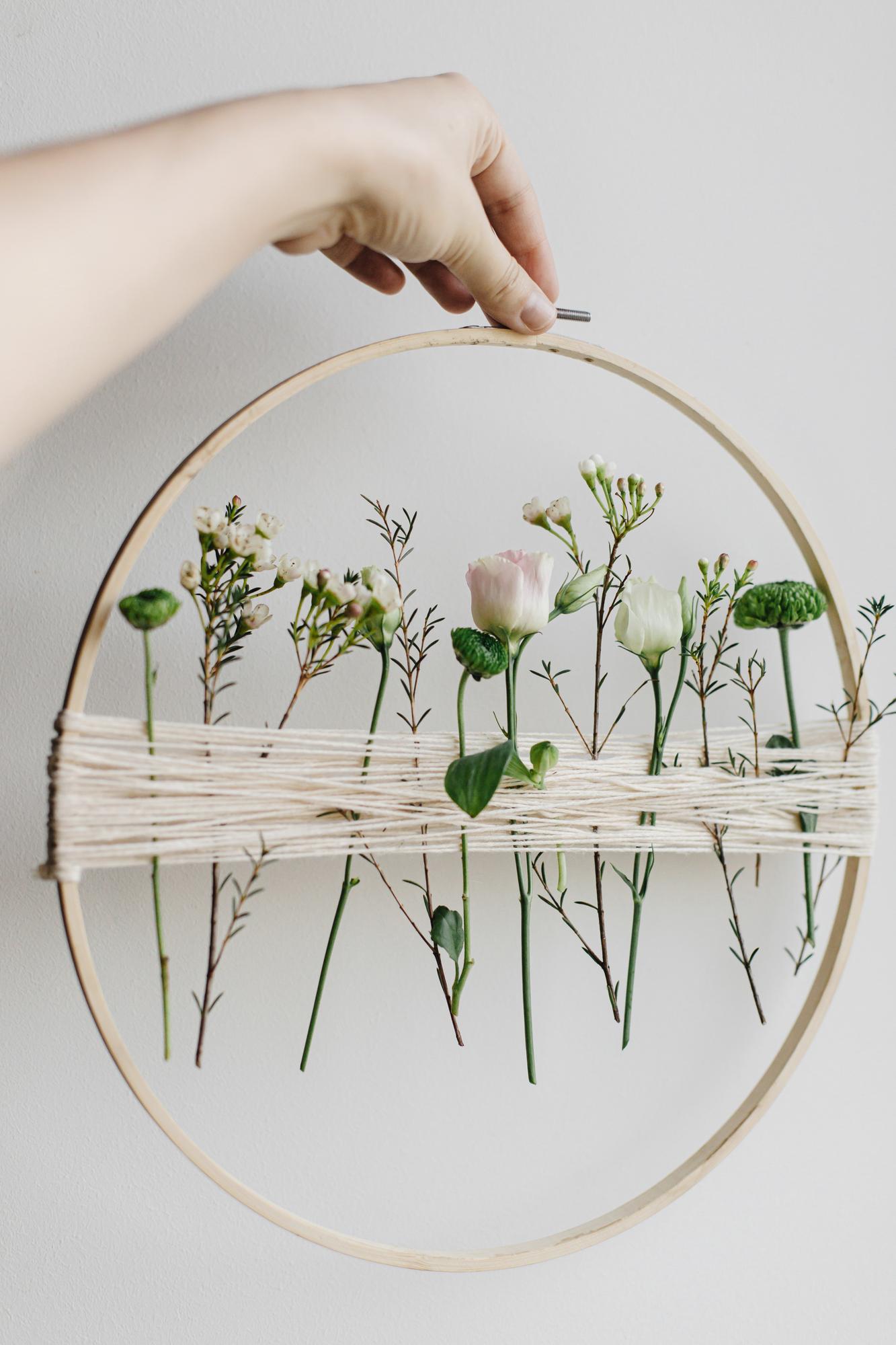 close-up of pastel hand embroidery hoop with floral motif